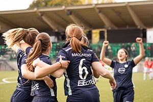 Young female soccer players, celebrating a win to include on self-serve roster management system profiles